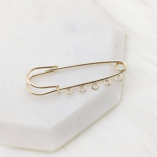 Charm Cascade Brooch Pin